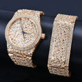 Luxury gold watch and bracelet set on a dark background